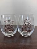 Tipsy or tipped stemless wine glass