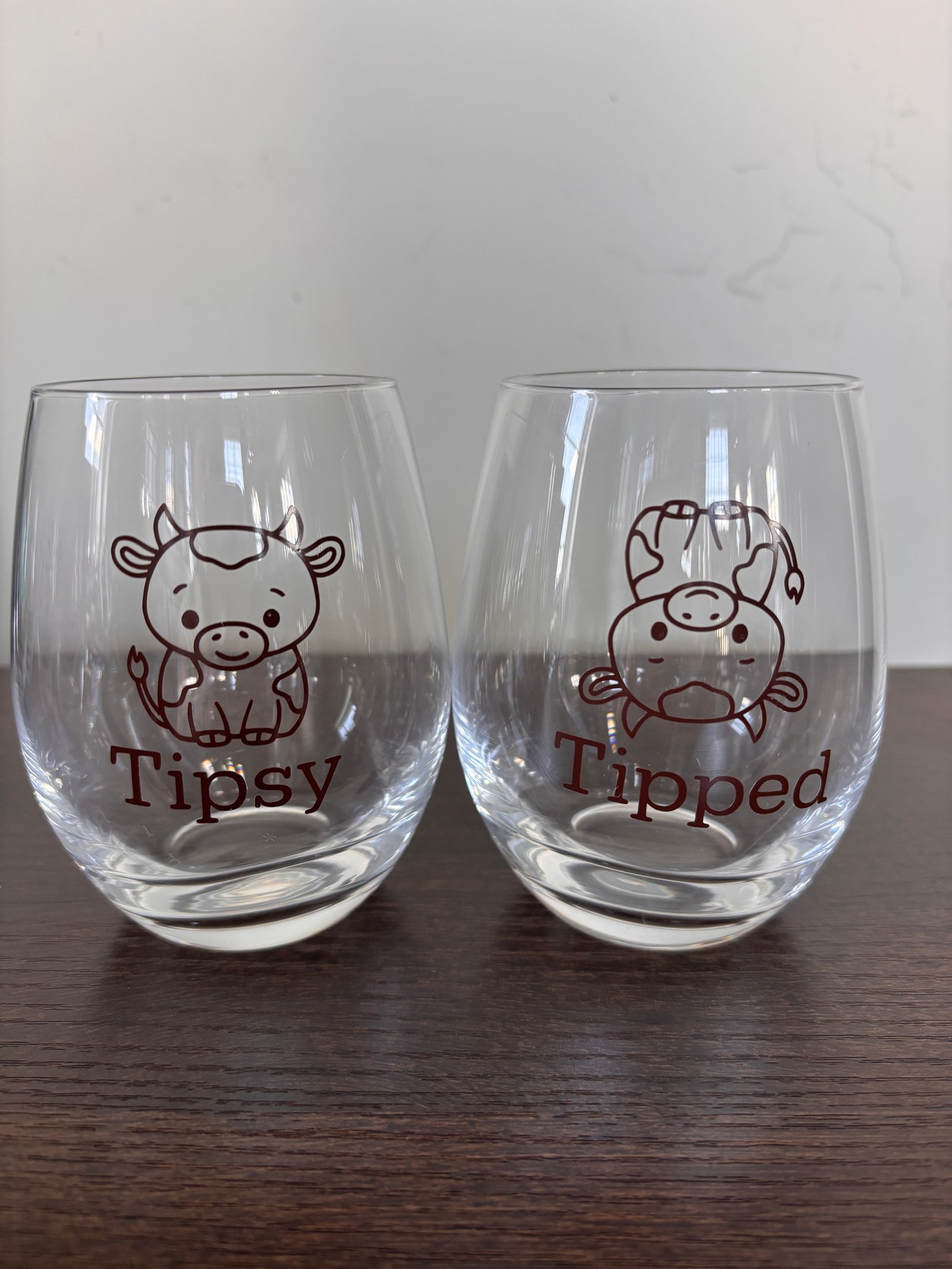 Tipsy or tipped stemless wine glass